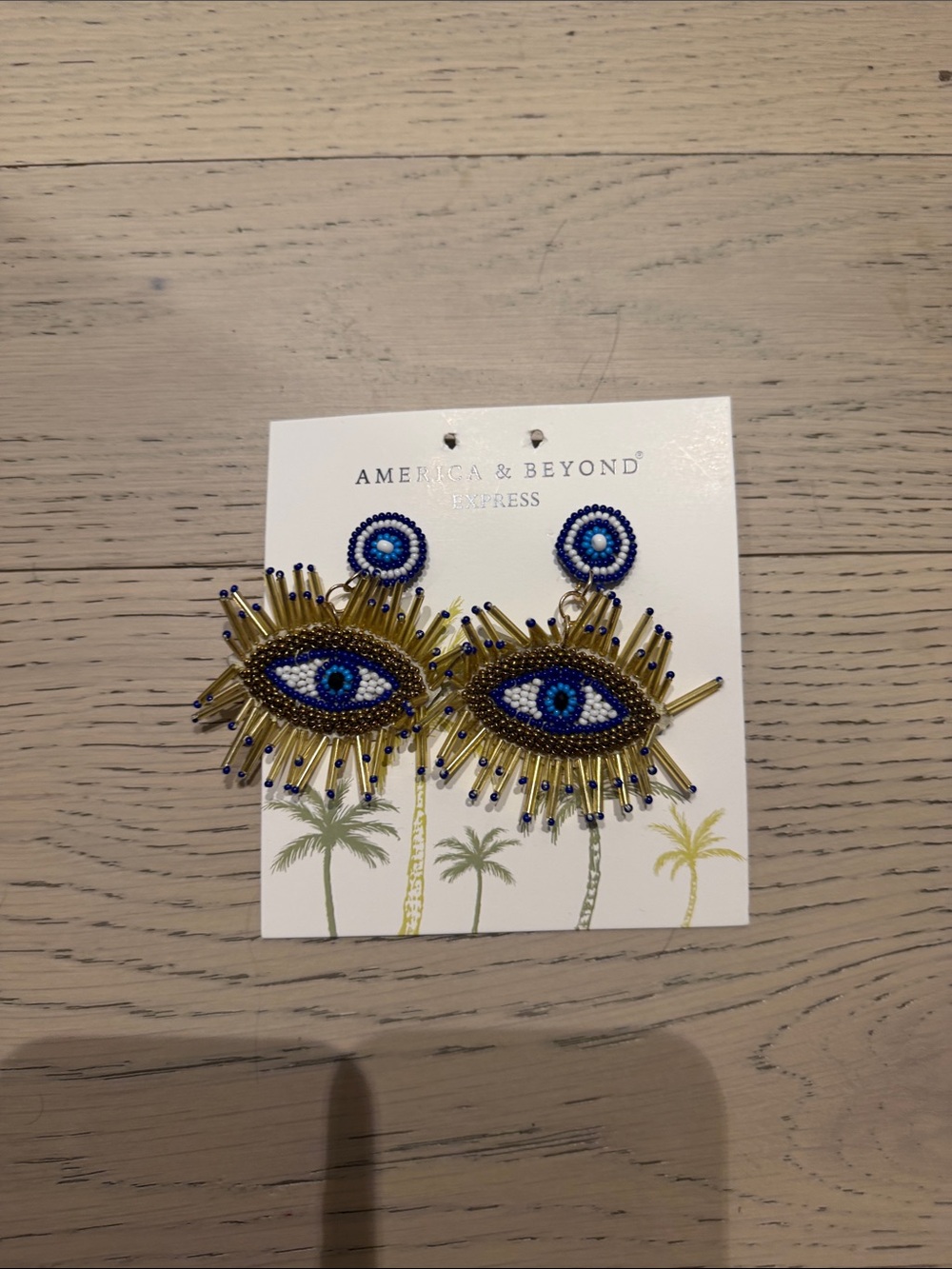 America & Beyond Express Blue and Gold Beaded Evil Eye Earrings